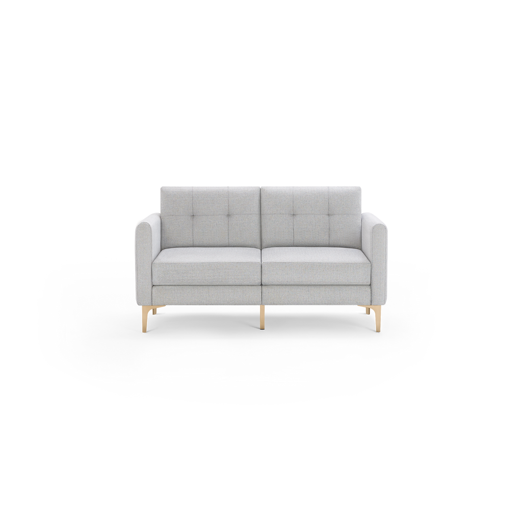 Light gray two-seater sofa with tufted back cushions and wooden legs, featuring a minimalist modern design.