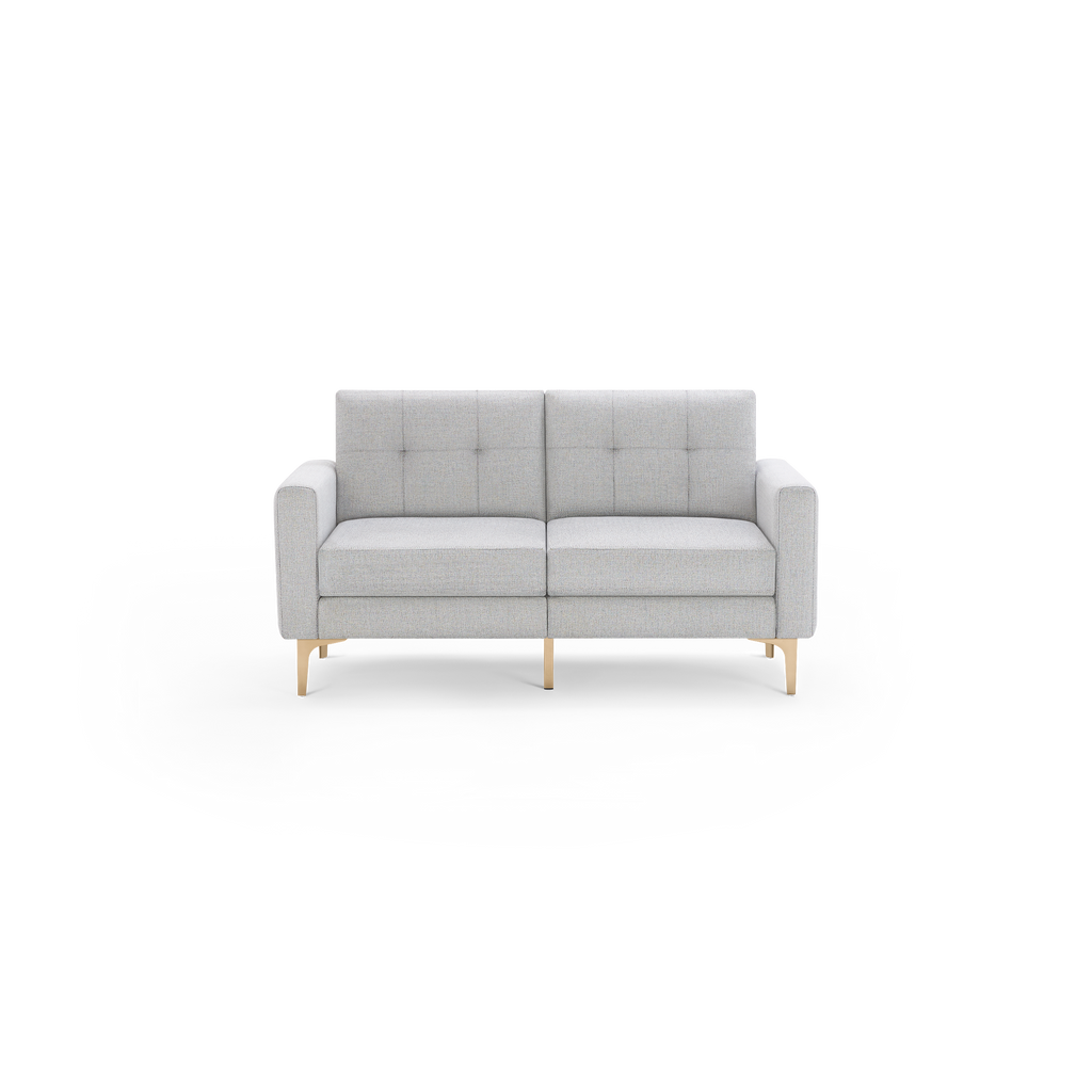 Light gray two-seater sofa with tufted back cushions, square arms, and beige wooden legs on a black background.