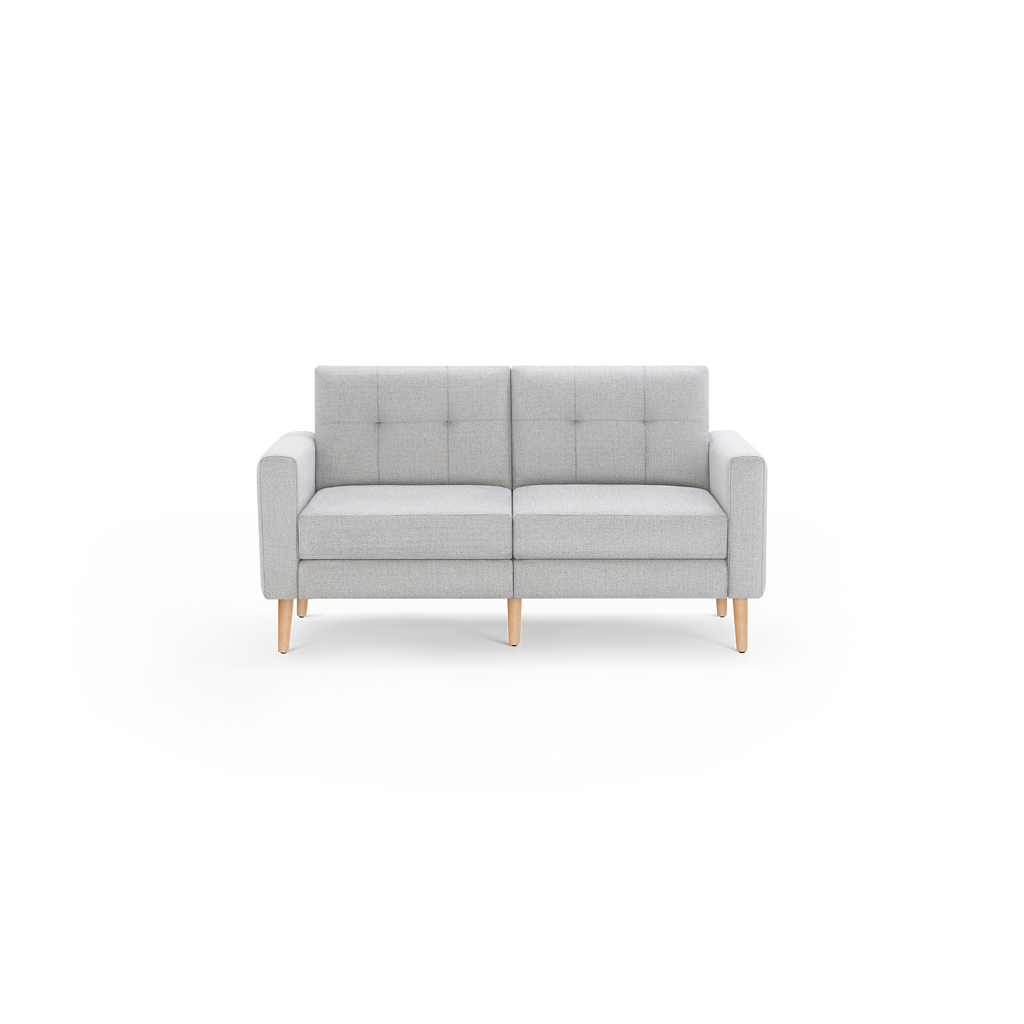 Light gray two-seater sofa with tufted back cushions, straight arms, and natural wooden legs in mid-century modern style.