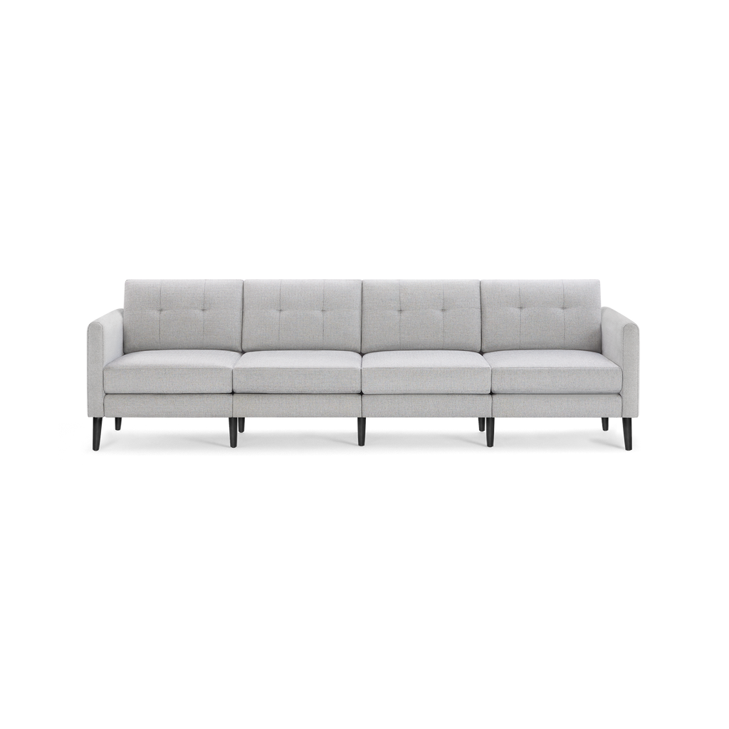 Modern light gray four-seater sofa with tufted back cushions and black tapered wooden legs, showcasing a clean, minimalist design.