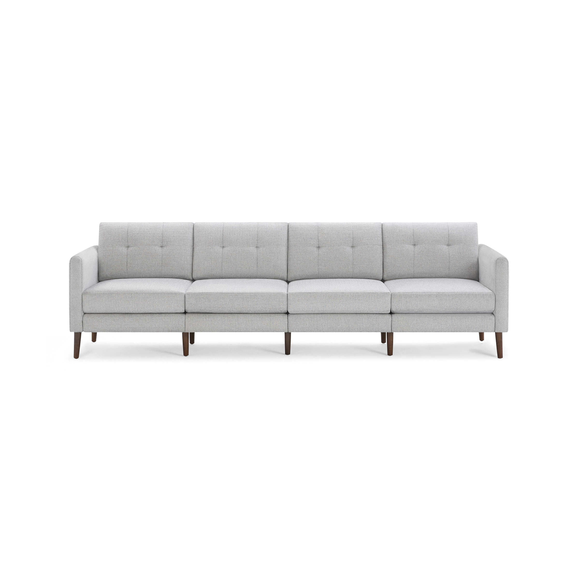 Light gray modern four-seater sofa with tufted back cushions, straight arms, and wooden legs on a black background.