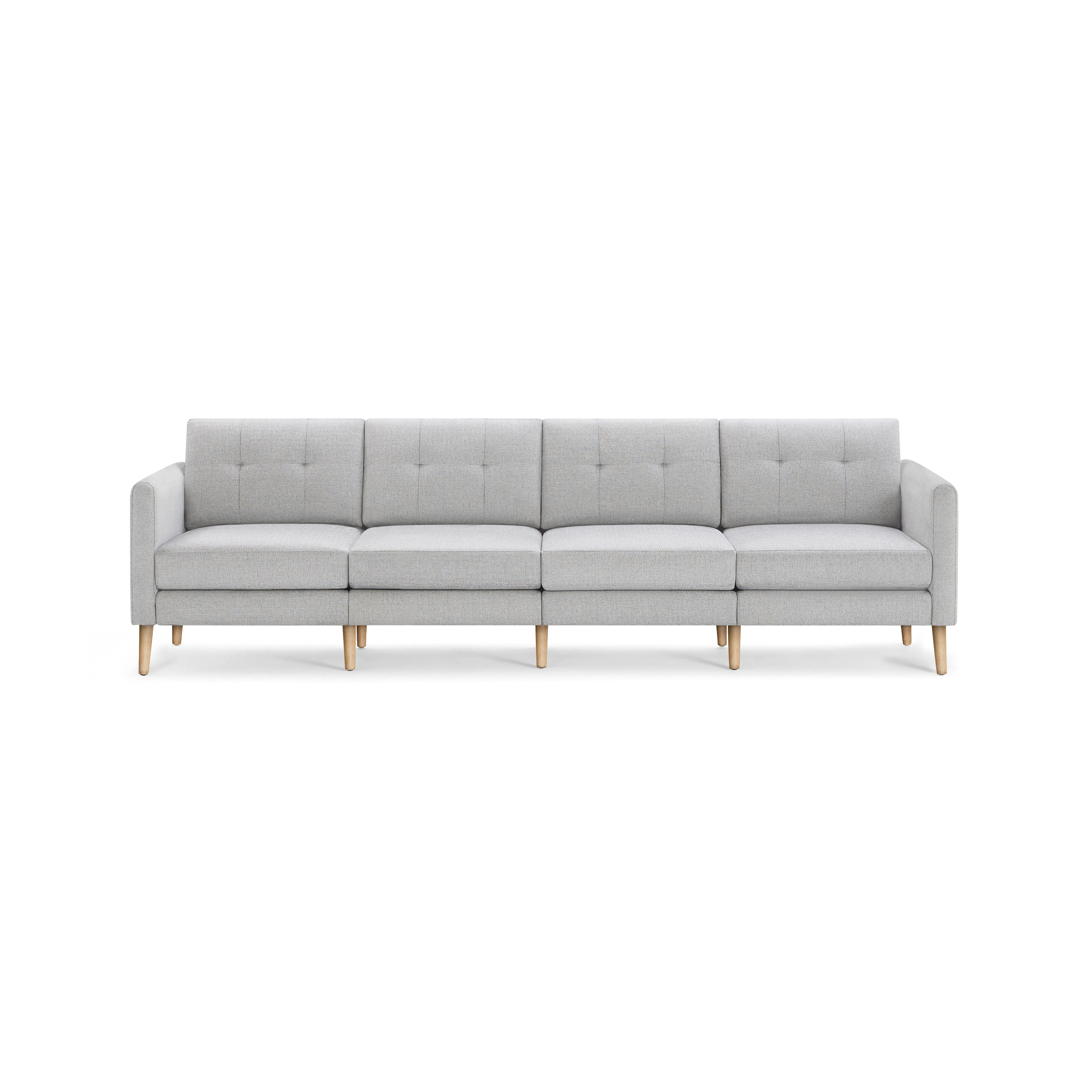 Light gray modern four-seater sofa with tufted back cushions and wooden legs, featuring clean lines and armrests on both ends.