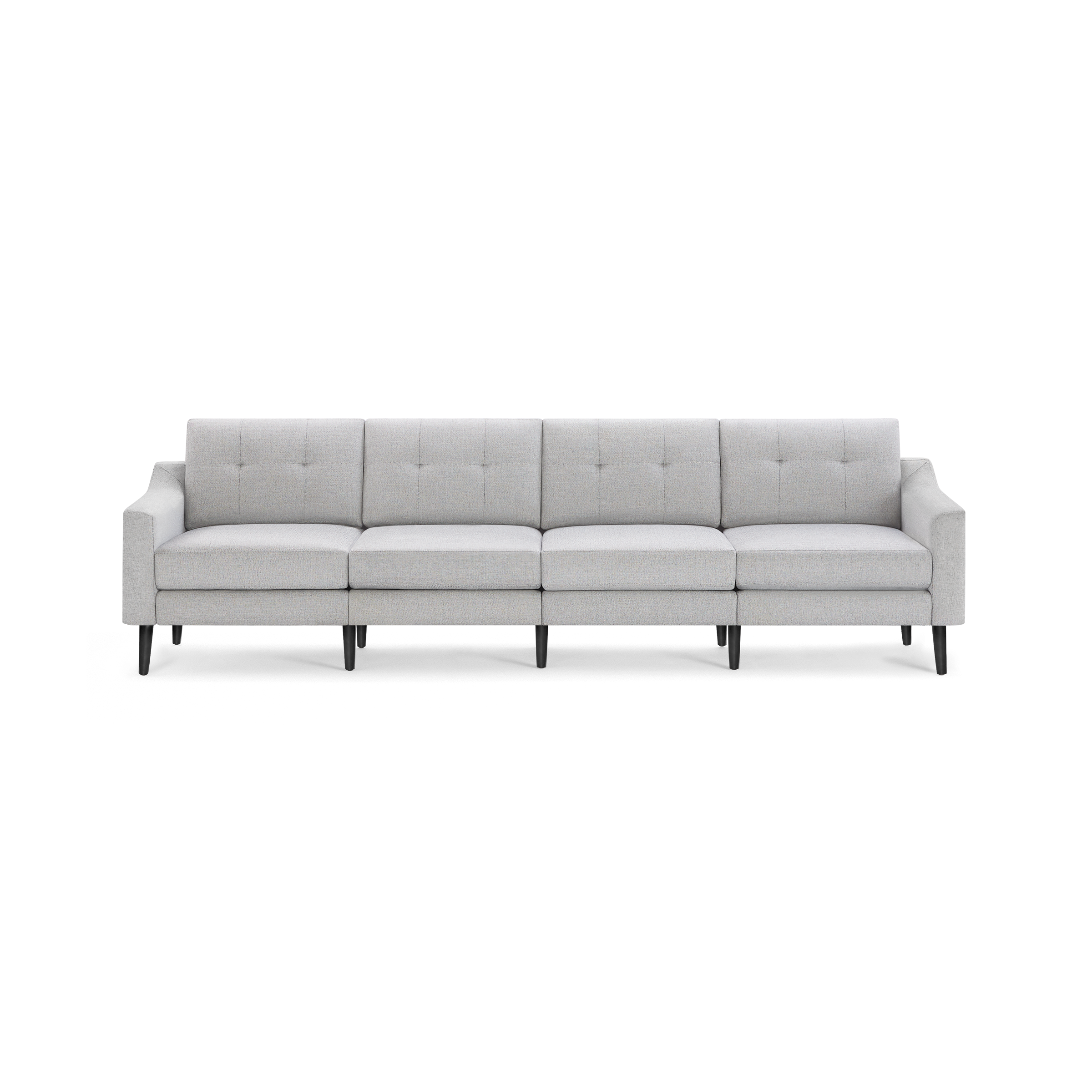 Light gray, modern four-seat sofa with tufted back cushions and black wooden legs on a black background.