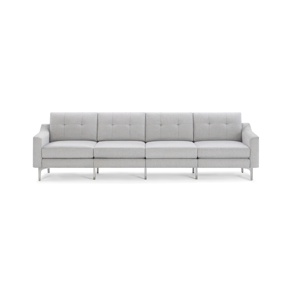 Modern light gray fabric sofa with tufted back cushions, metal legs, and straight armrests, seating four people.
