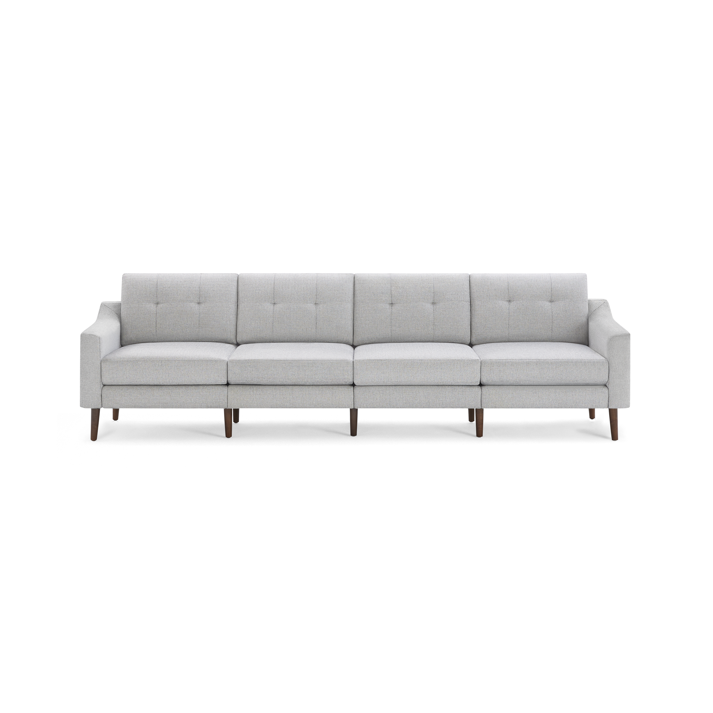 Light gray modern four-seater sofa with tufted backrest cushions and wooden tapered legs on a black background.