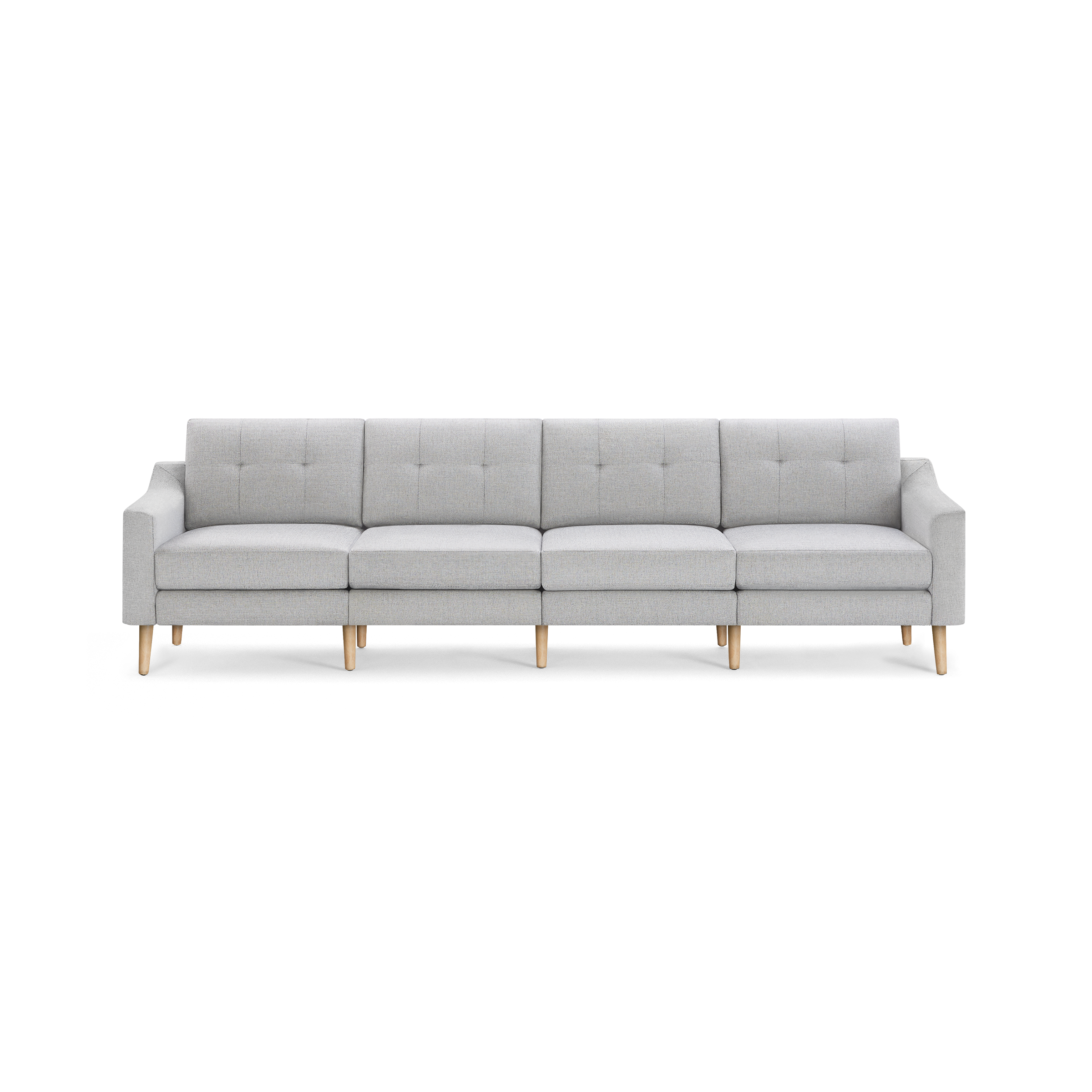 Light gray modern four-seat sofa with wooden legs, straight arms, and button-tufted back cushions on a black background.