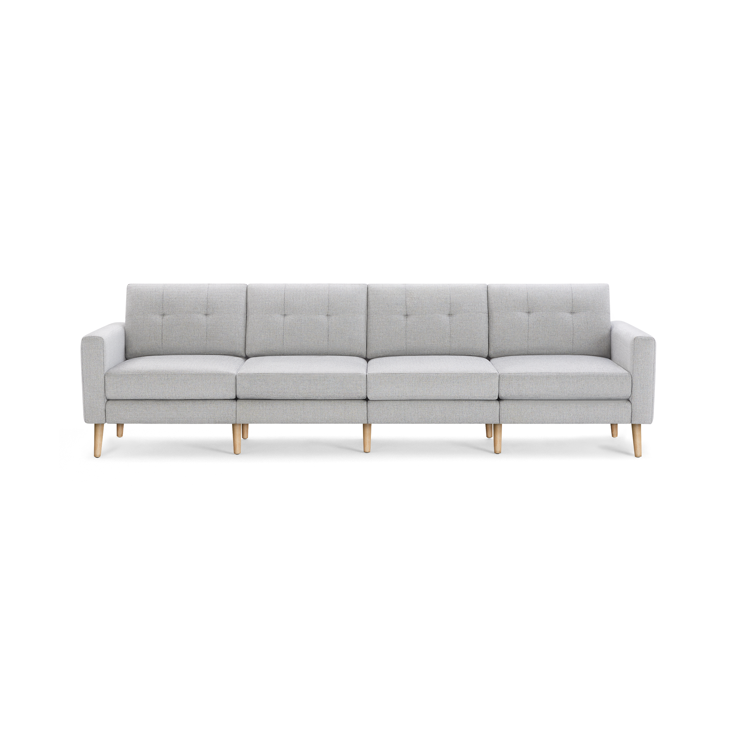 Light gray modern four-seater sofa with wooden legs, tufted back cushions, and clean, straight armrests.