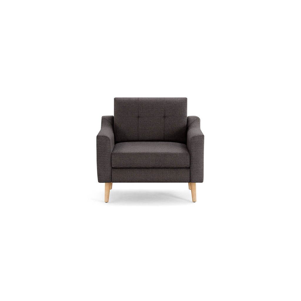 Modern dark gray upholstered armchair with clean lines, tufted backrest, padded seat, and light wooden legs against black background.