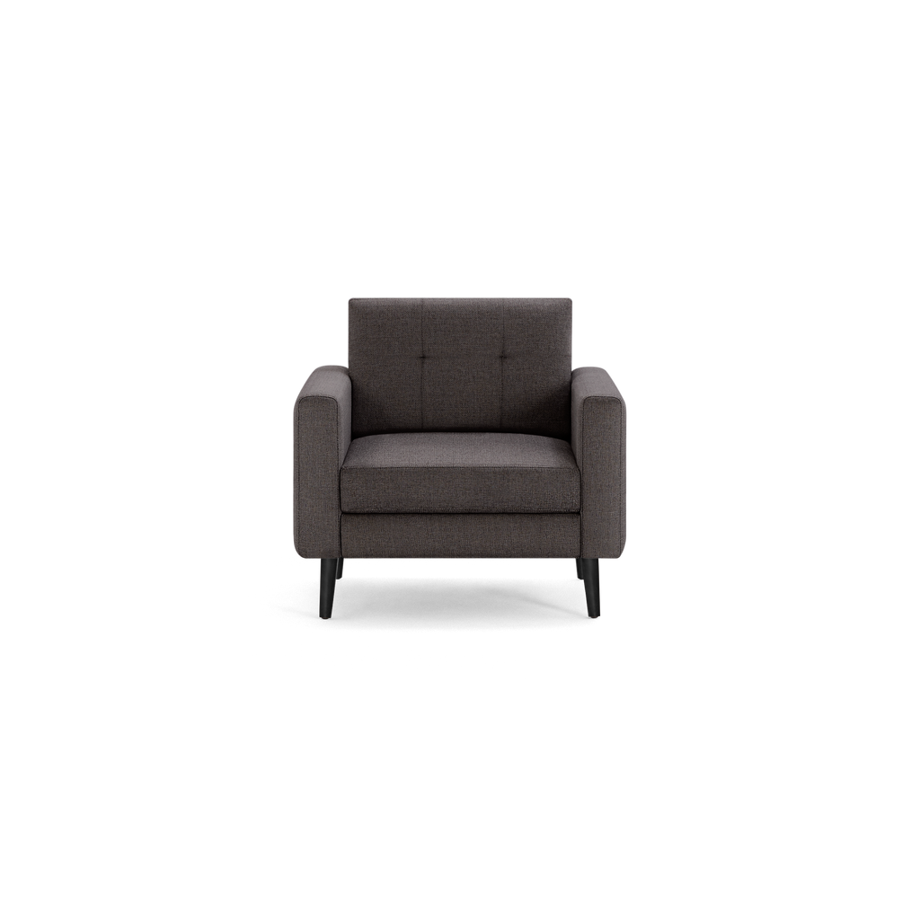 Dark gray fabric armchair with wide armrests, tufted backrest, and four angled black legs, shown on a white background.