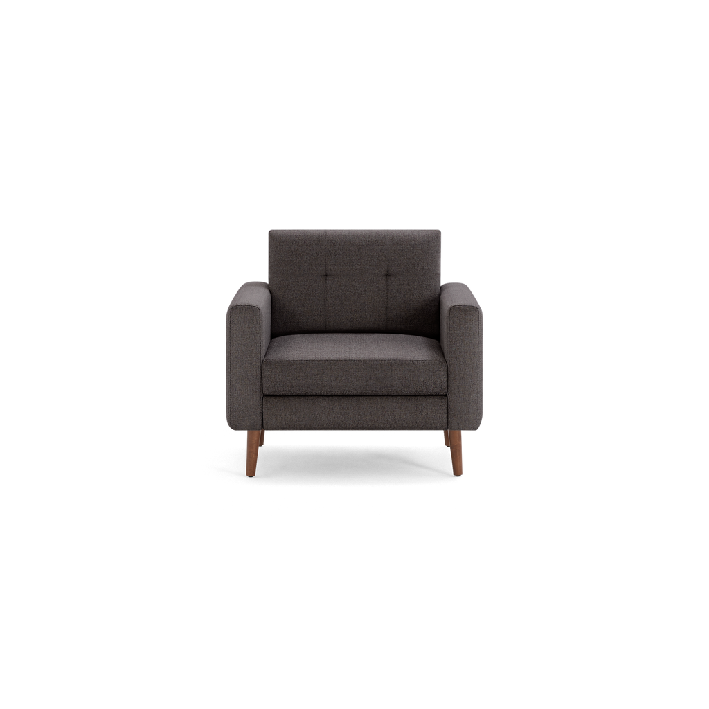 Dark gray fabric armchair with tufted backrest, wide armrests, and wooden tapered legs, shown from front.
