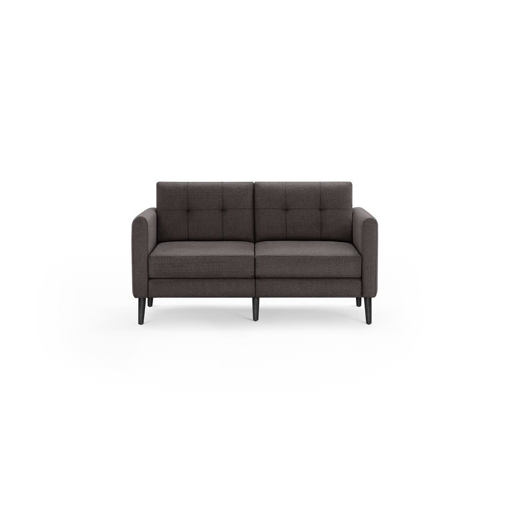 Dark gray mid-century modern two-seater sofa with tufted back cushions and slim black wooden legs.