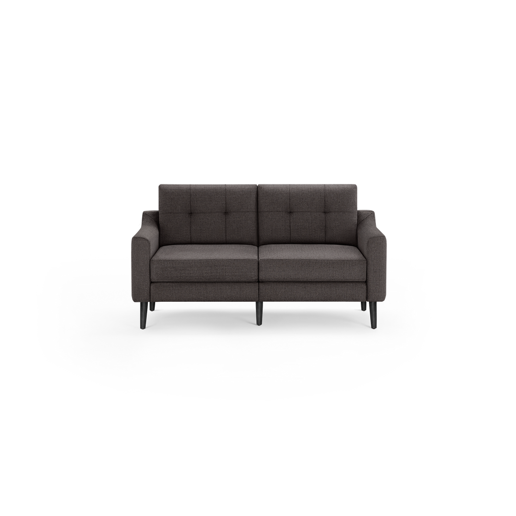 Dark gray two-seater sofa with tufted back cushions, square armrests, and black tapered legs on a black background.