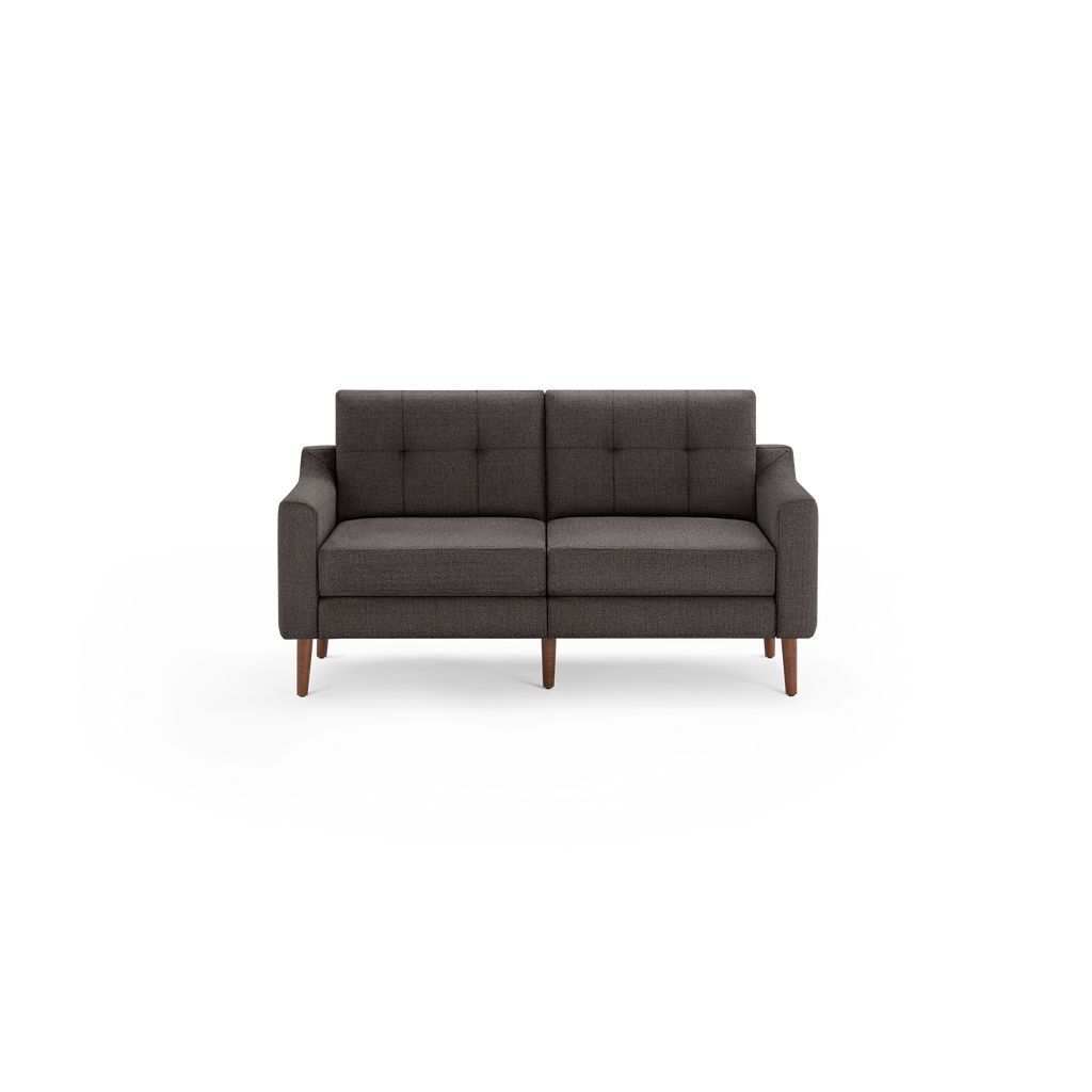 Dark gray mid-century modern two-seater sofa with tufted back cushions and wooden legs on a black background.