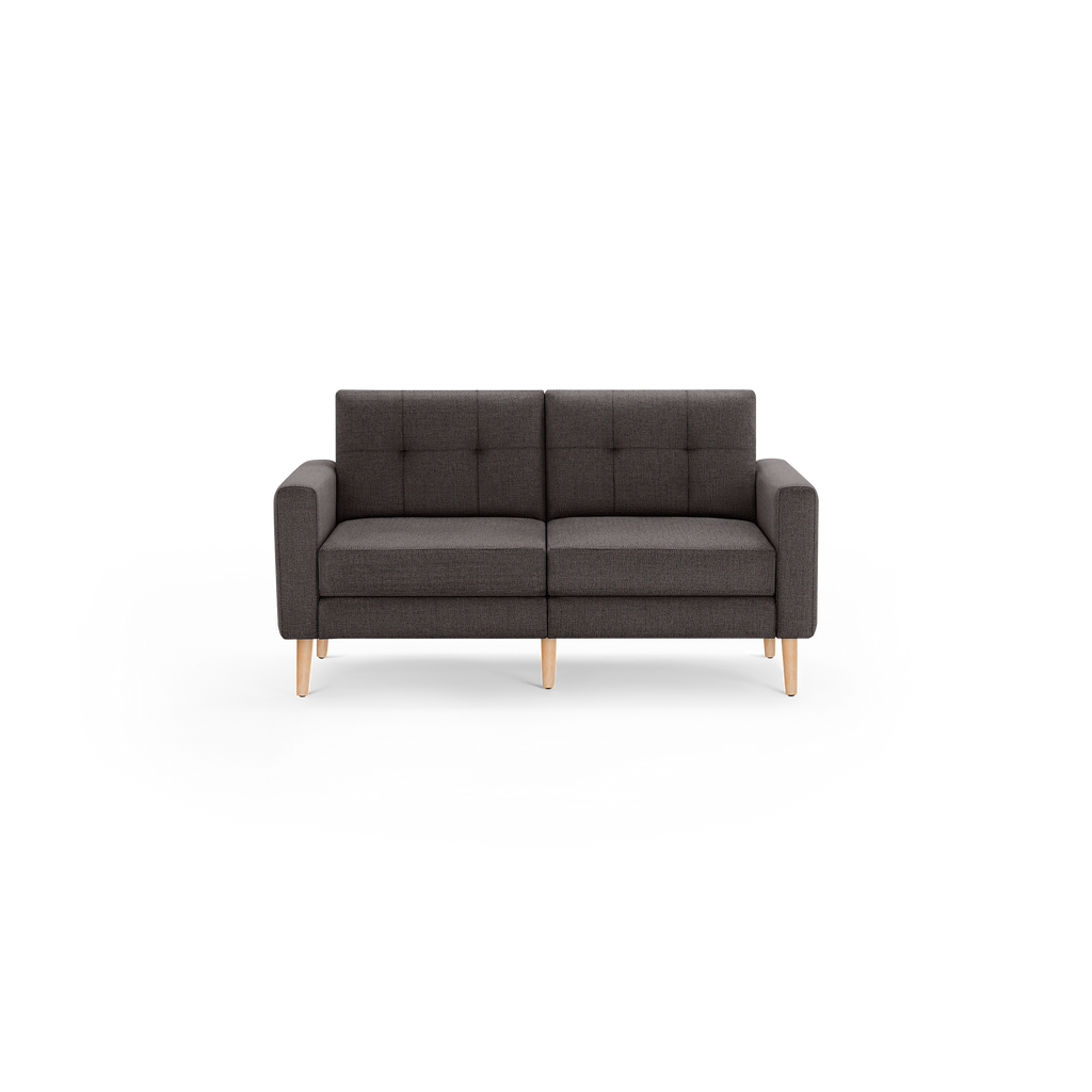 Modern dark gray fabric loveseat with tufted backrests and light wooden legs, featuring clean lines and a minimalist design.