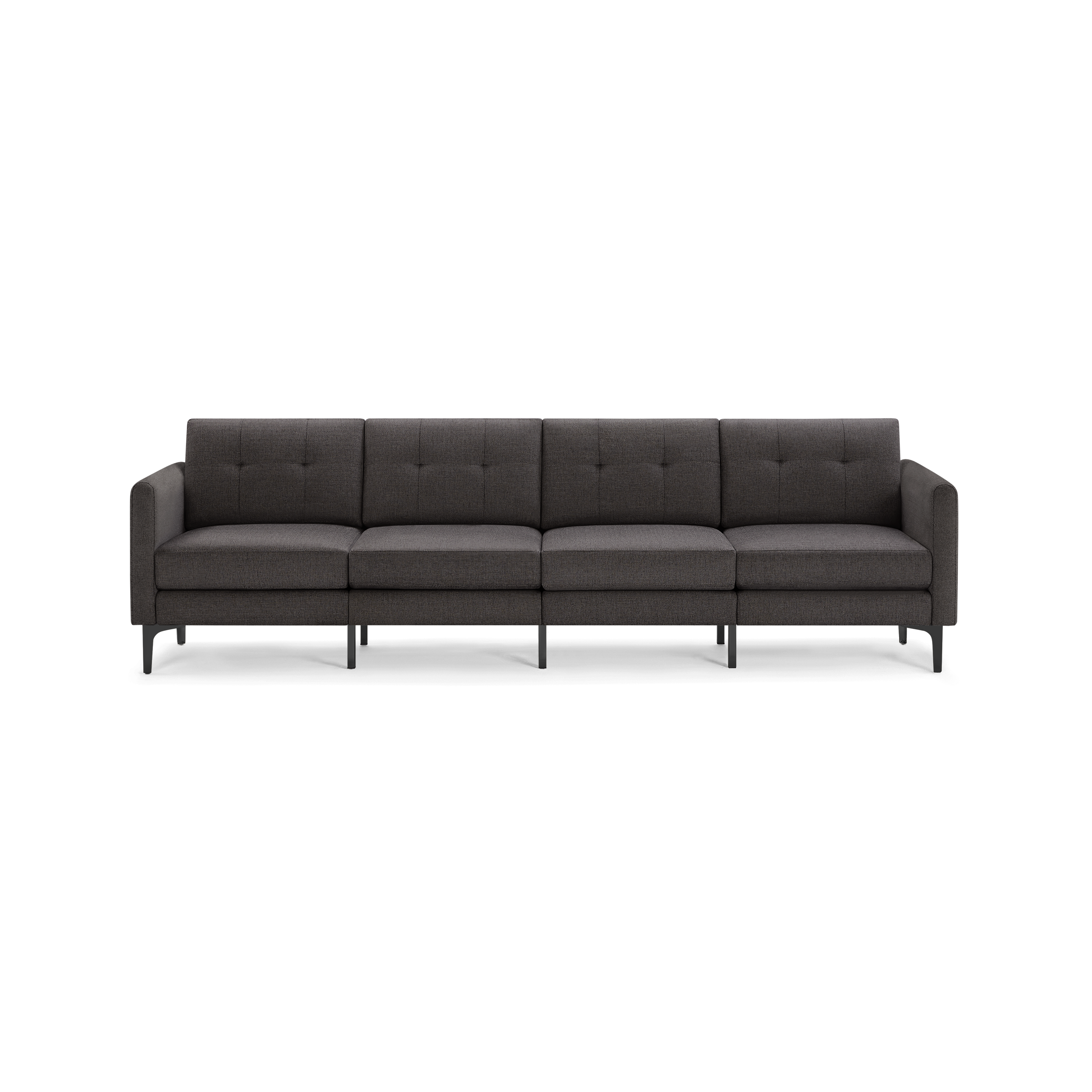 Modern dark gray fabric four-seater sofa with tufted cushions, straight armrests, and black metal legs against a transparent background.