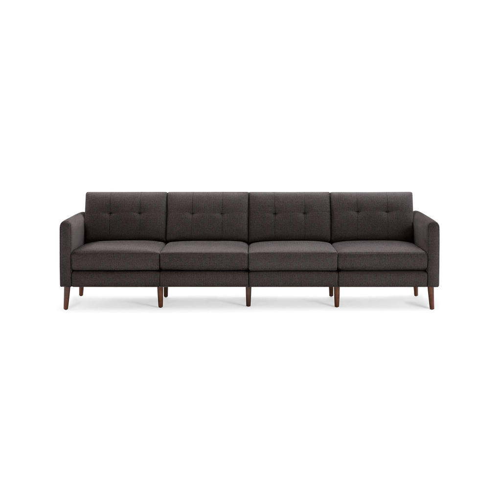 Dark gray modern four-seat fabric sofa with button-tufted backrests and wooden legs, featuring clean-lined armrests.