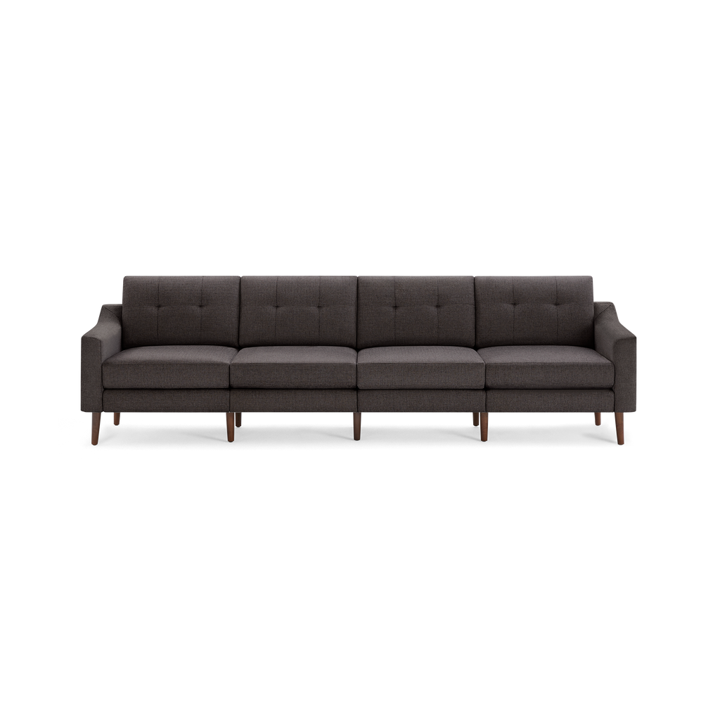 Long modern dark gray fabric sofa with tufted back cushions and wooden tapered legs, designed for spacious seating.