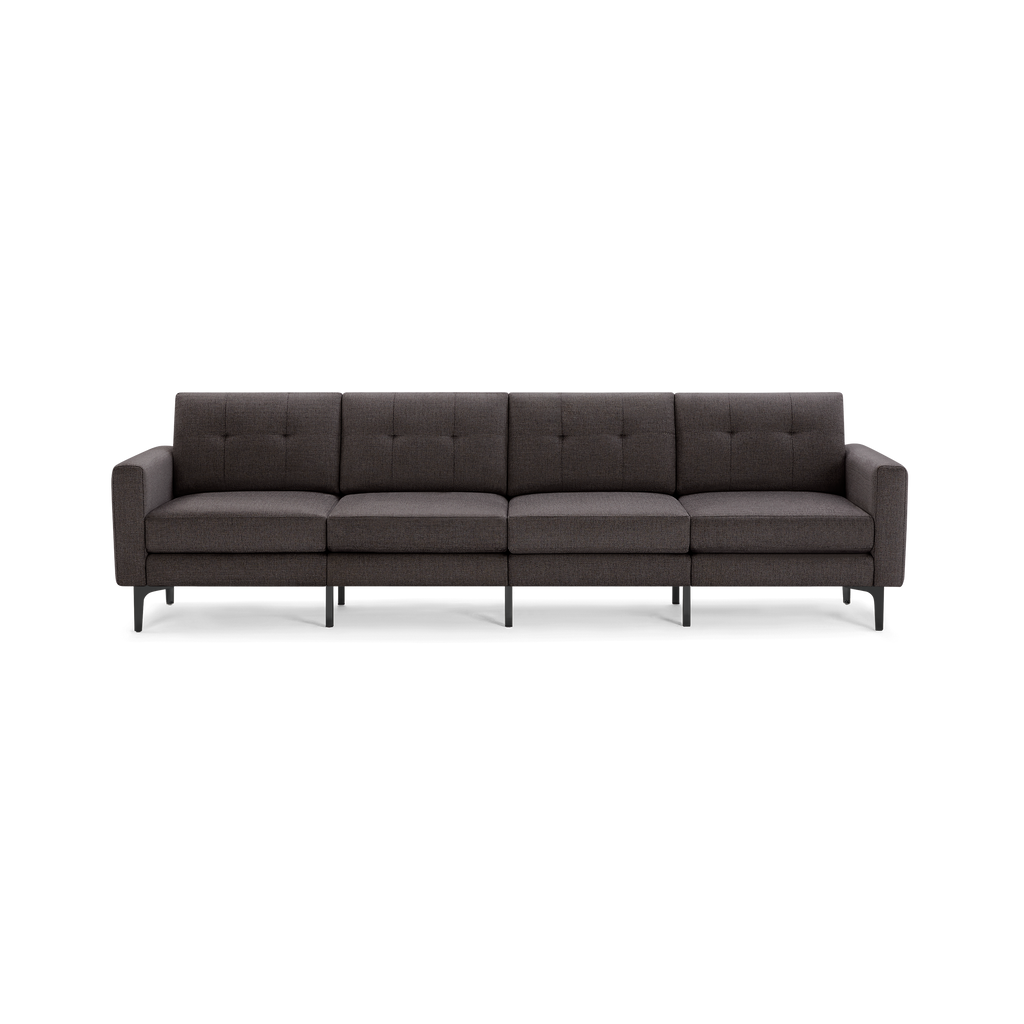 Modern long dark gray fabric sofa with tufted back cushions and slim black legs, designed for four people.