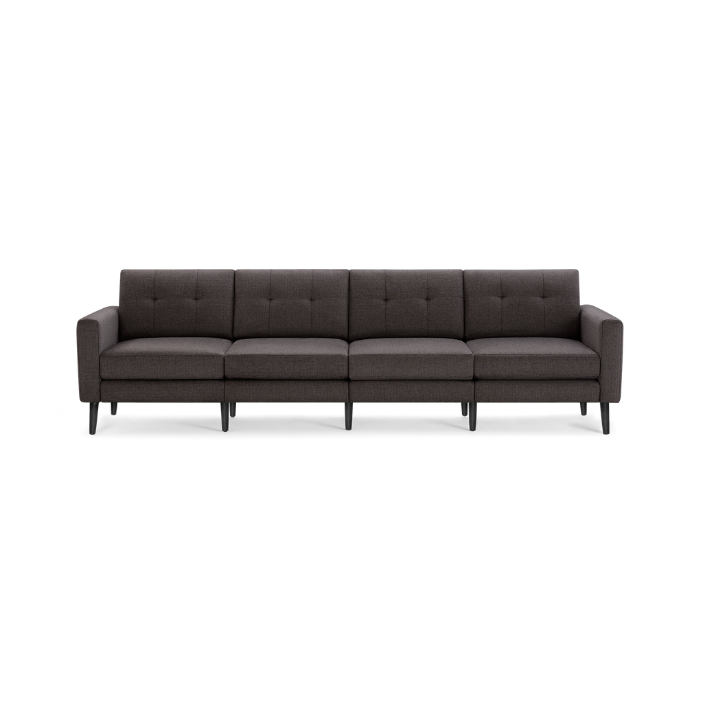 Dark gray four-seat sofa with tufted back cushions, slim armrests, and six black wooden legs.