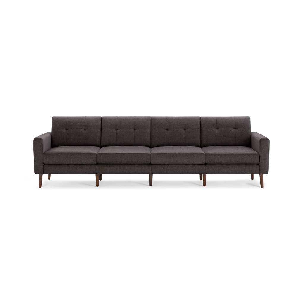 Four-seater modern dark gray fabric sofa with tufted backrests, square armrests, and tapered wooden legs.