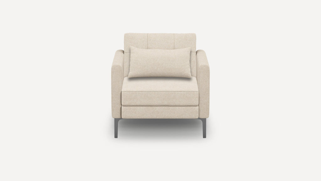 Front view of a modern beige armchair with a matching lumbar pillow and sleek metal legs against a plain background.