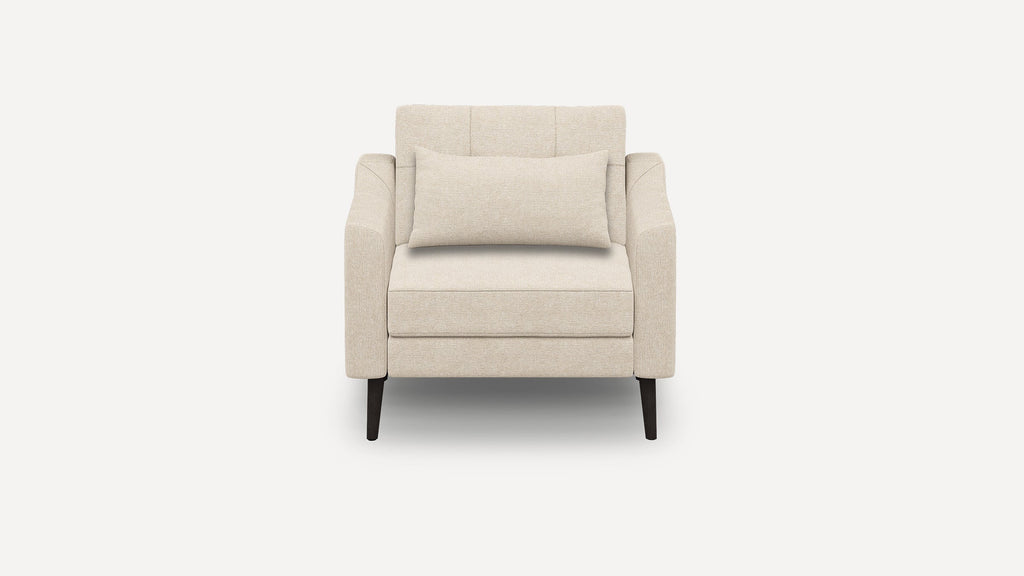 Front view of a beige upholstered single-seater armchair with a matching rectangular cushion and dark wooden legs.