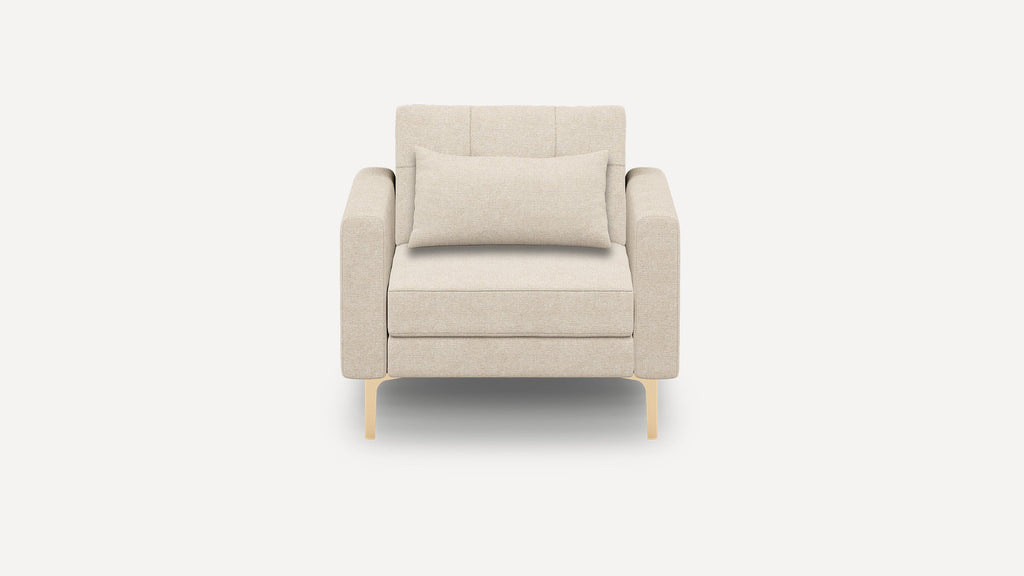 Front view of a modern beige fabric armchair with square armrests, a rectangular lumbar pillow, and light wooden legs.