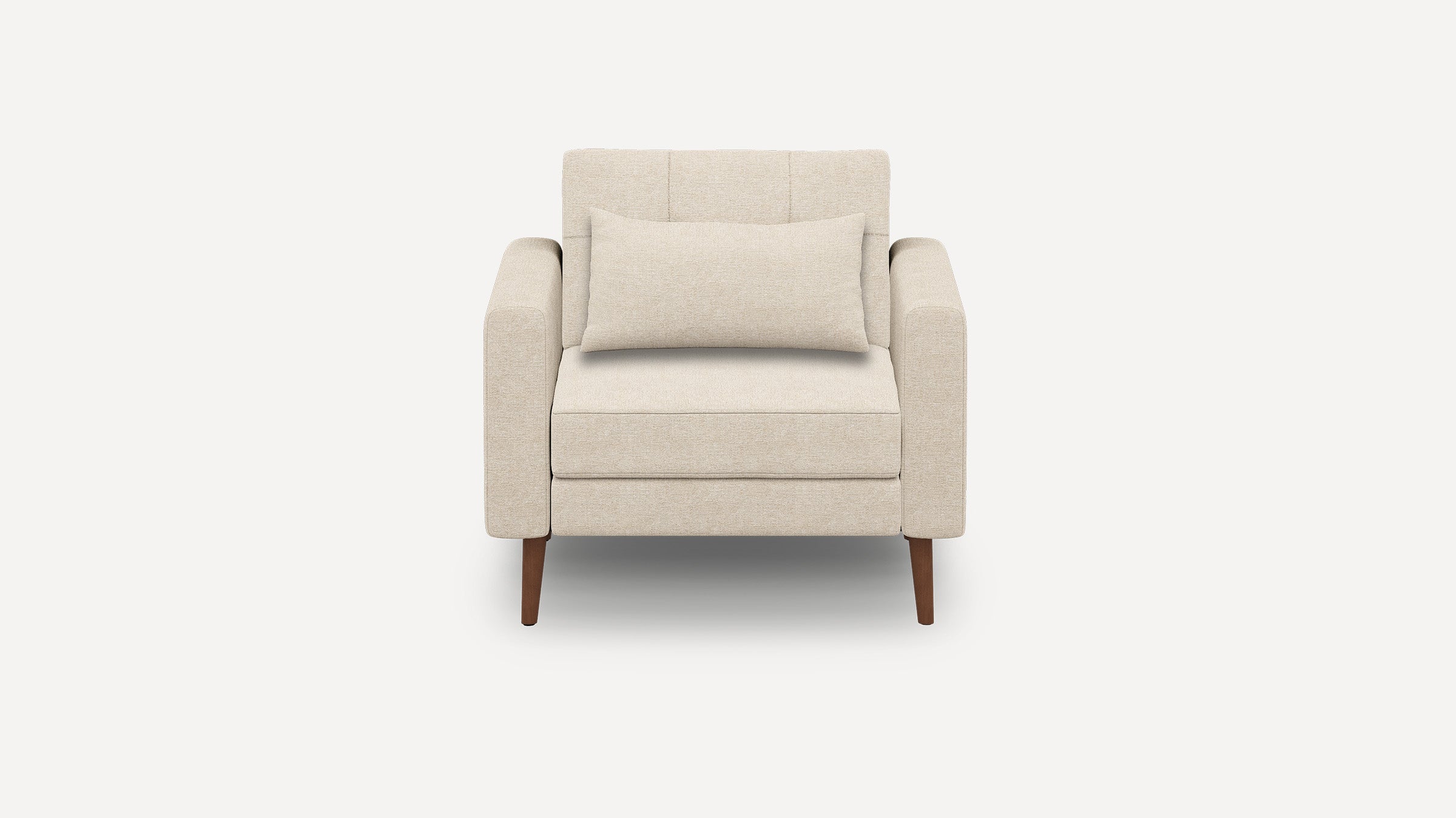 Beige upholstered armchair with straight arms, a rectangular lumbar pillow, and four tapered wooden legs.