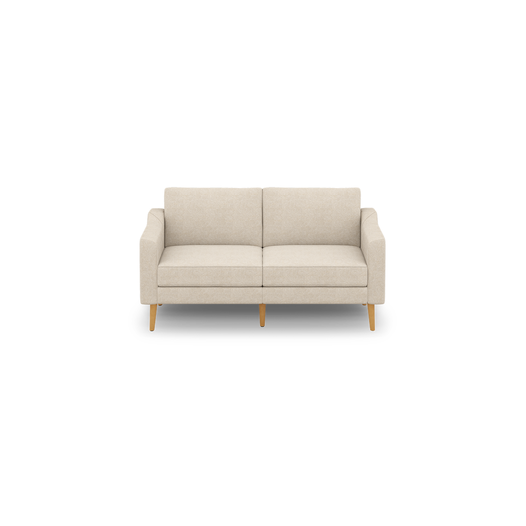 Beige two-seater sofa with clean lines, cushioned back and seats, and four light wooden legs on a black background.