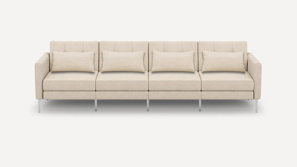 Beige modern four-seater sofa with clean lines, square cushions, and slim metal legs on a white background.