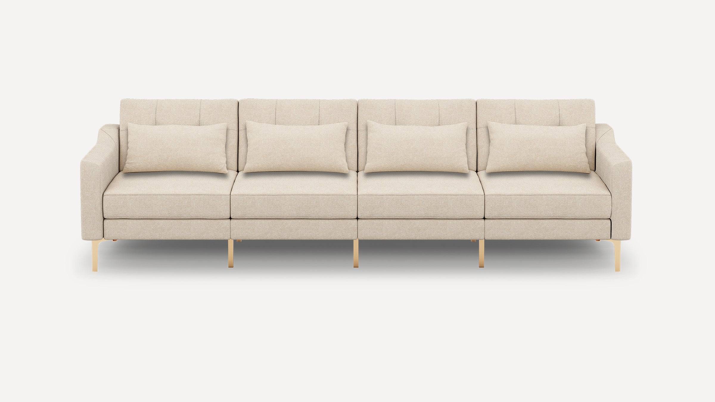 Beige modern four-seater sofa with clean lines, gold metal legs, and four matching lumbar pillows on a white background.