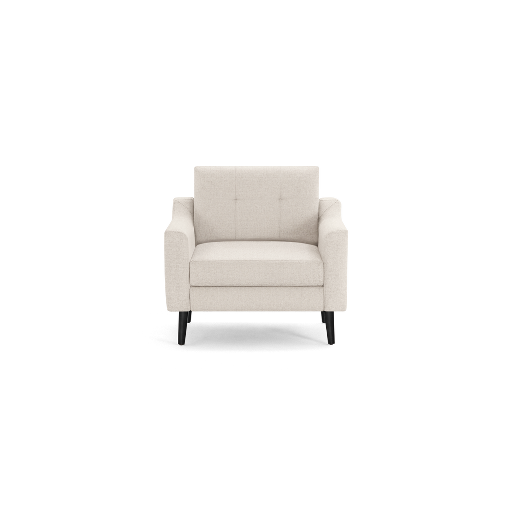 Beige upholstered armchair with tufted backrest, cushioned seat, and black wooden tapered legs, shown on white background.
