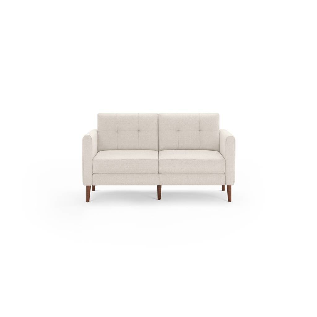 Beige modern loveseat sofa with tufted back cushions, straight armrests, and wooden tapered legs on black background.