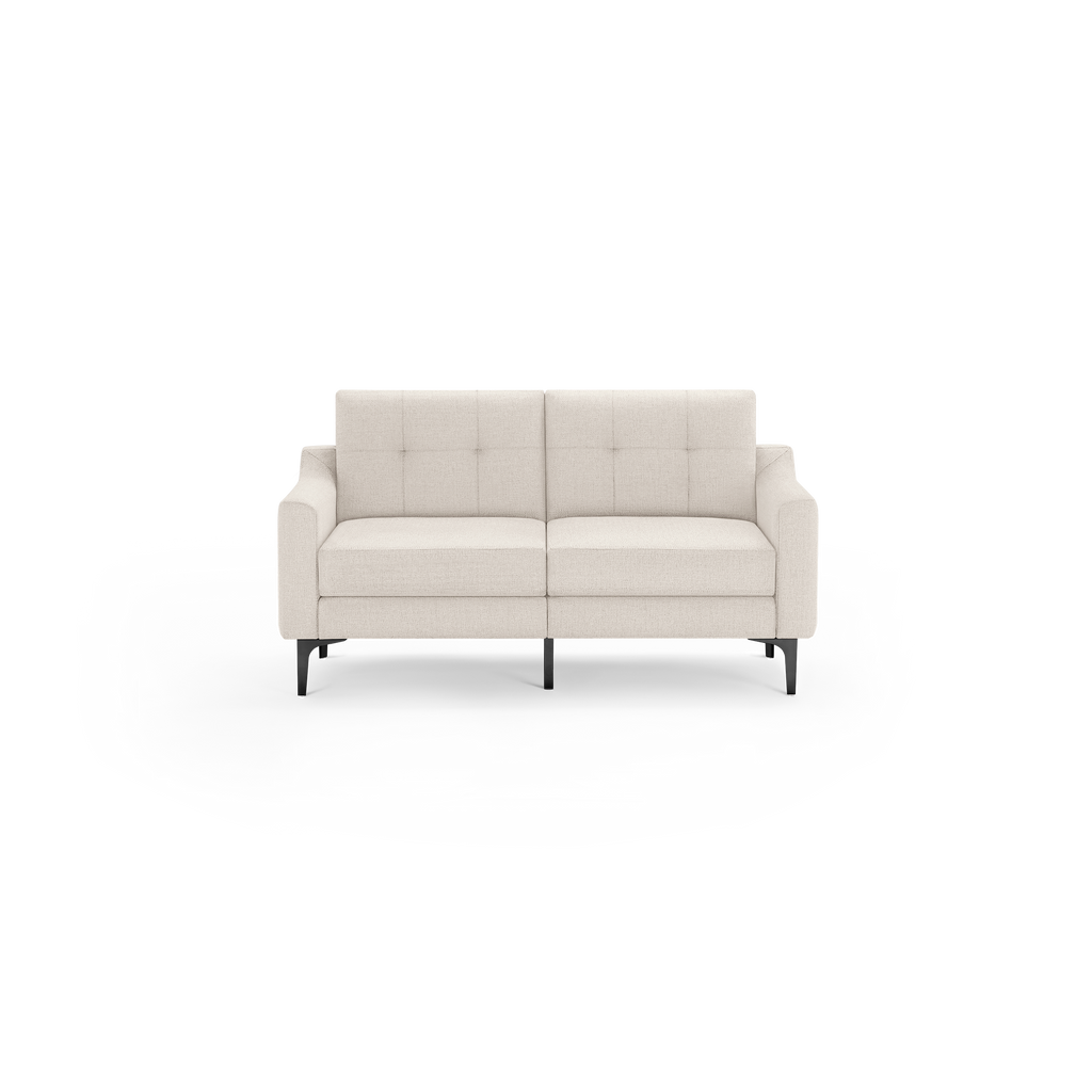 Modern beige fabric two-seater sofa with tufted backrest, cushioned seats, slightly curved armrests, and black metal legs.