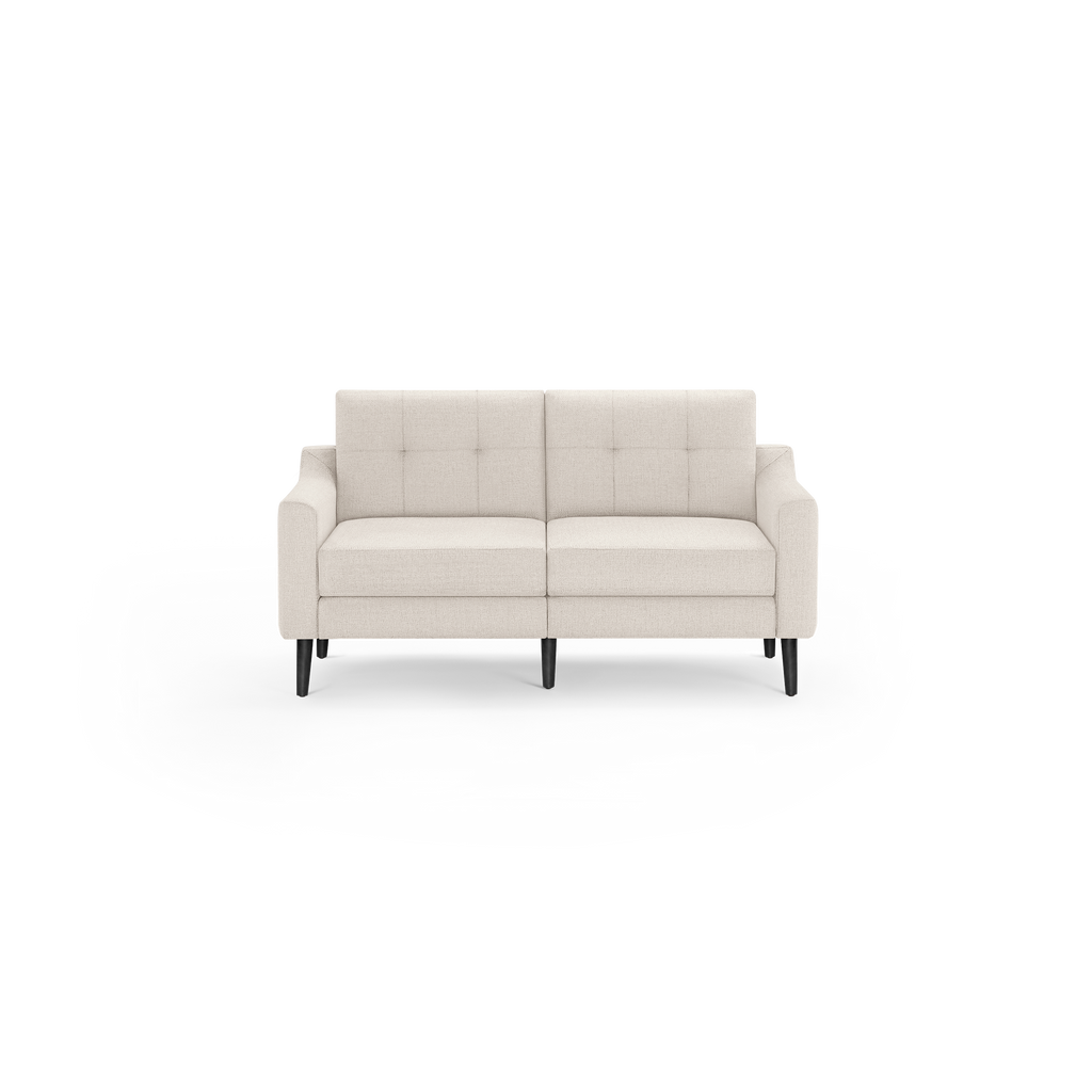 Beige two-seater sofa with tufted backrest, padded arms, and black wooden legs in minimalist design.