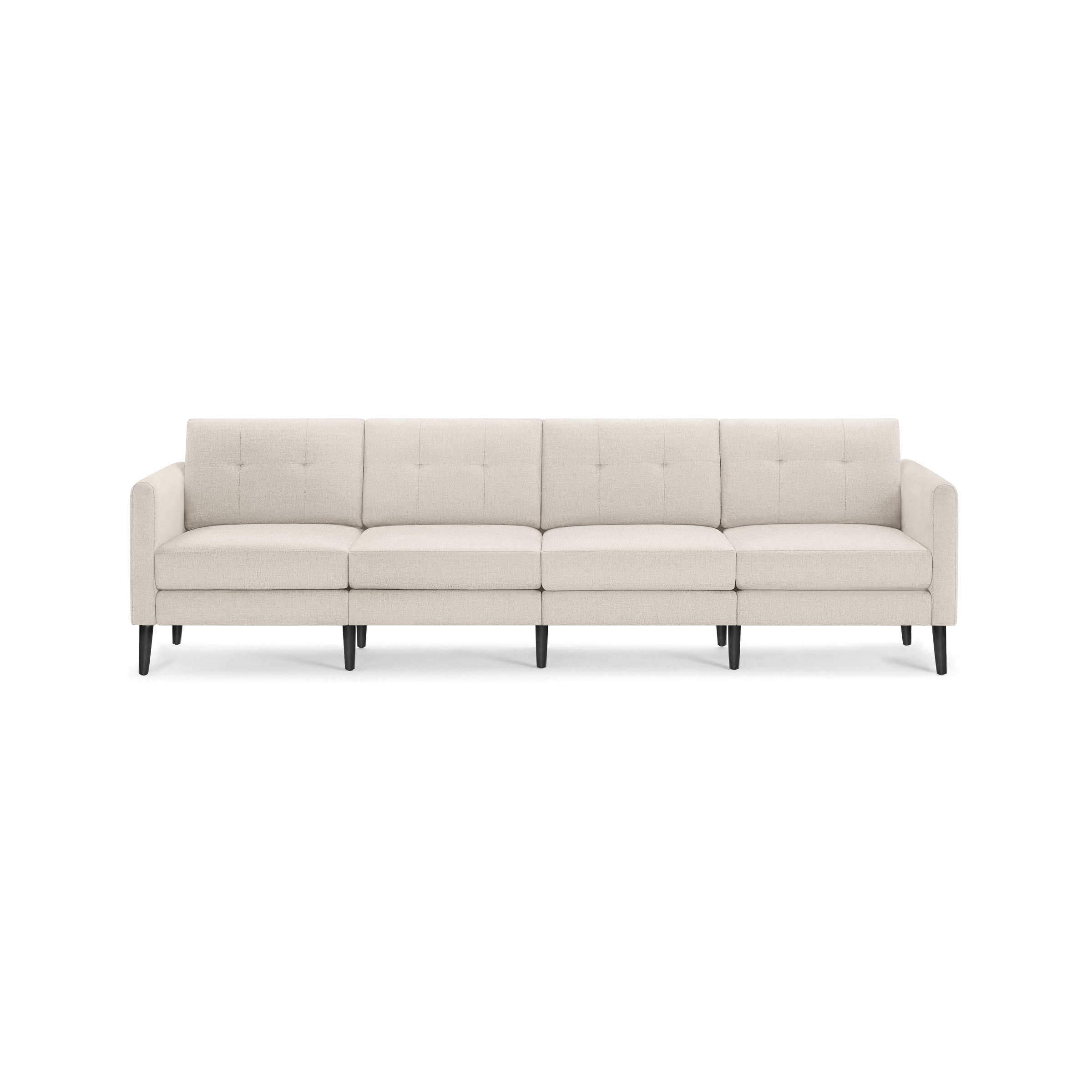 Cream-colored four-seat modern sofa with tufted back cushions and black tapered wooden legs.