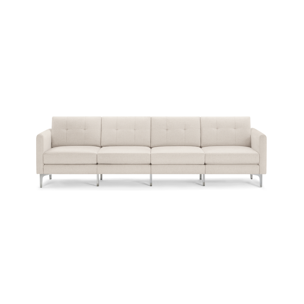 Four-seater modern beige fabric sofa with tufted back cushions and slim metal legs, featuring squared armrests.