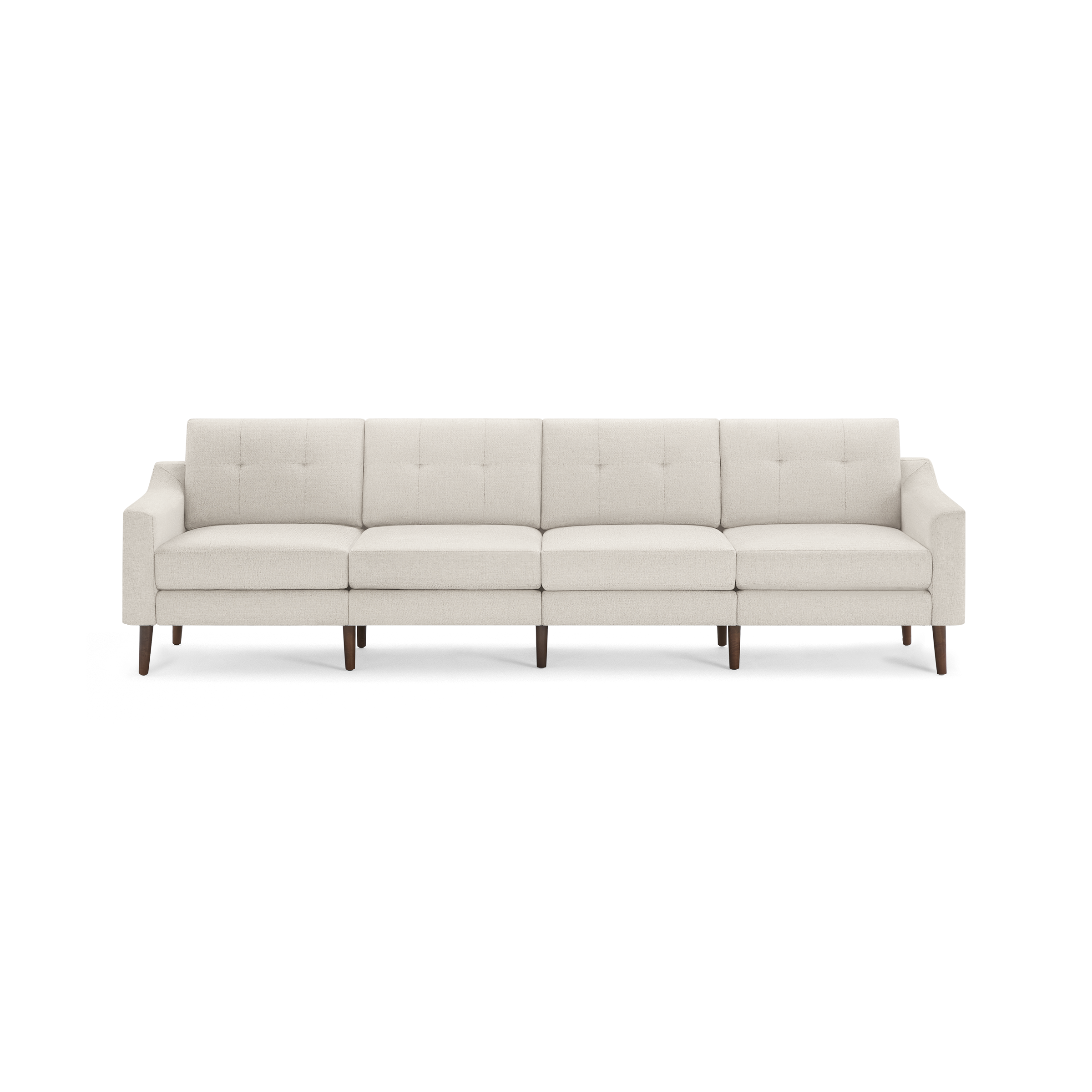 Four-seat beige fabric sofa with tufted back cushions, slim arms, and dark wooden legs.