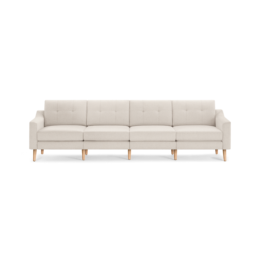 Light beige modern sectional sofa with tufted back cushions, clean lines, and wooden legs, designed for spacious seating.