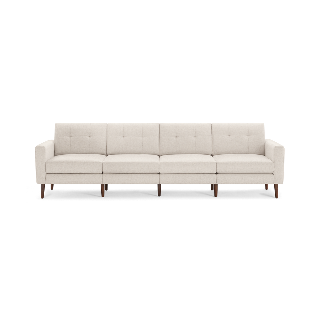 Modern beige fabric four-seater sofa with tufted backrests and wooden legs, featuring clean lines and a minimalist design.