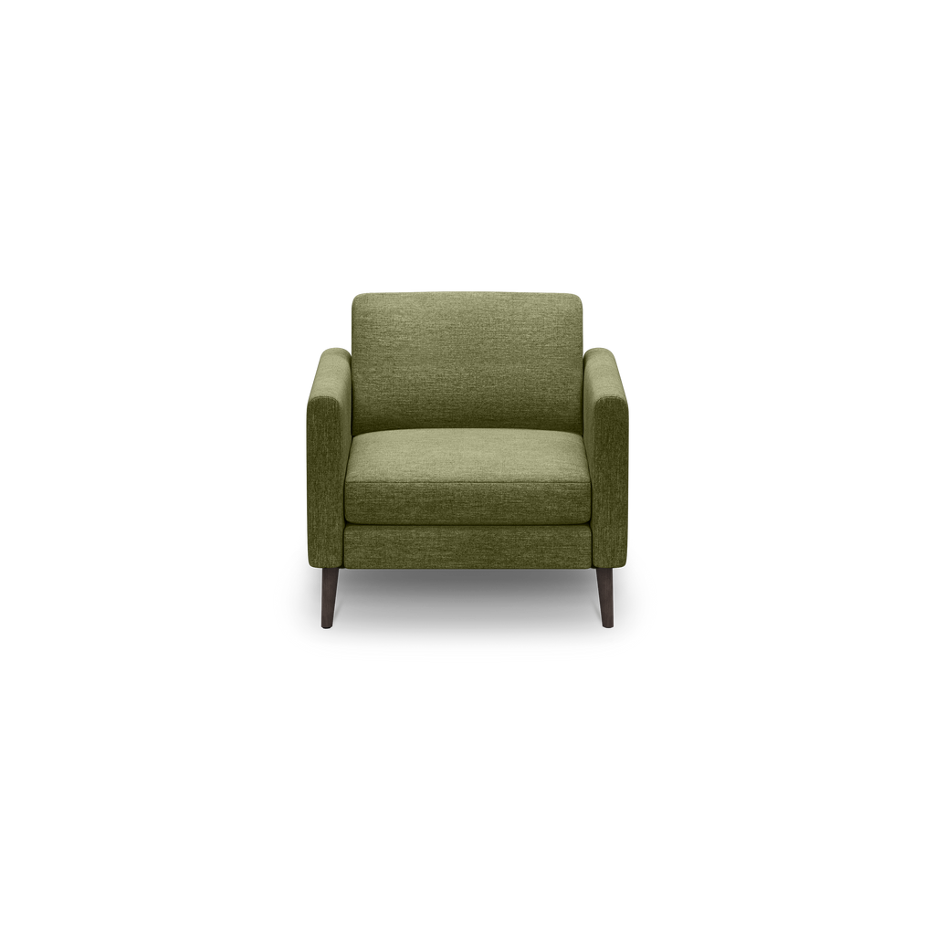 Olive green upholstered armchair with boxy design, padded seat and back cushions, straight armrests, and four dark wooden legs on black background.