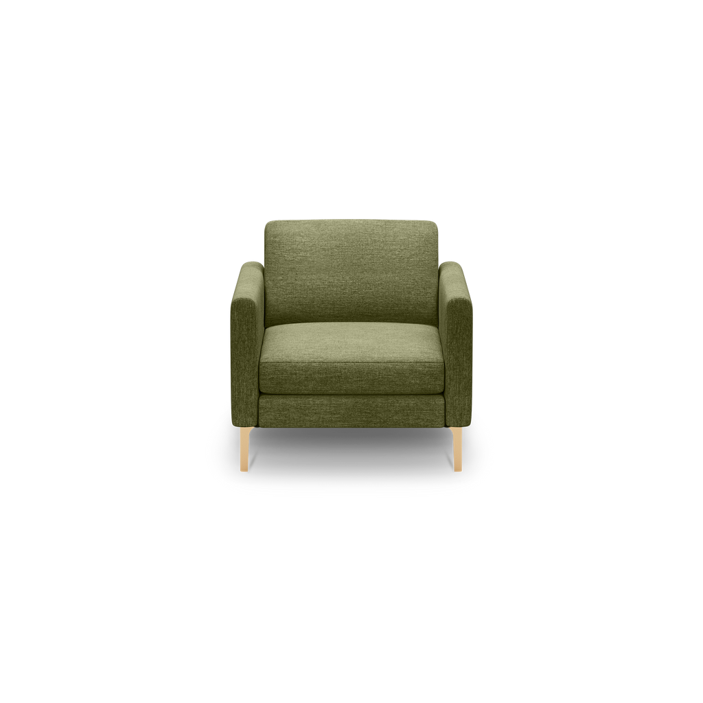 Green upholstered armchair with boxy design, cushioned seat, straight arms, and light wooden legs, shown against black background.
