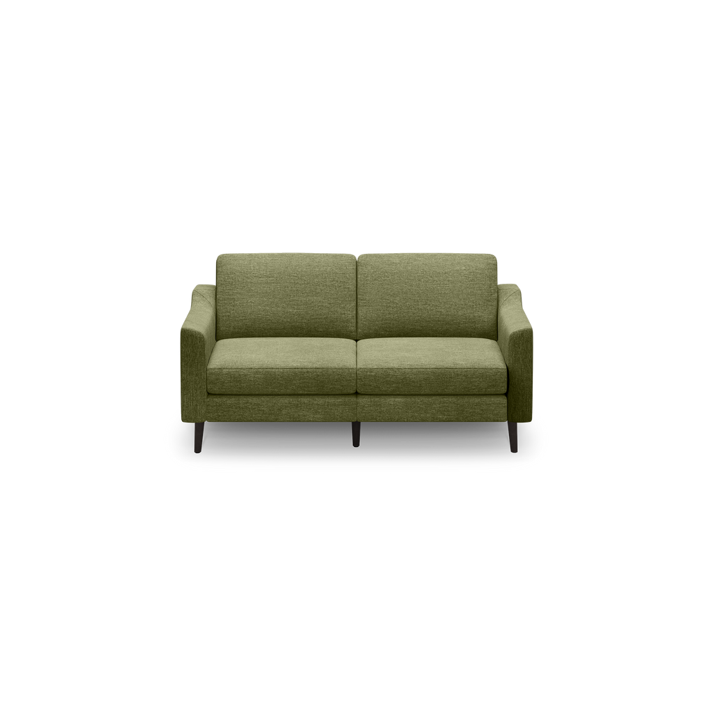 Green upholstered two-seat sofa with clean lines, cushioned back and seat, and dark wooden legs isolated on black background.