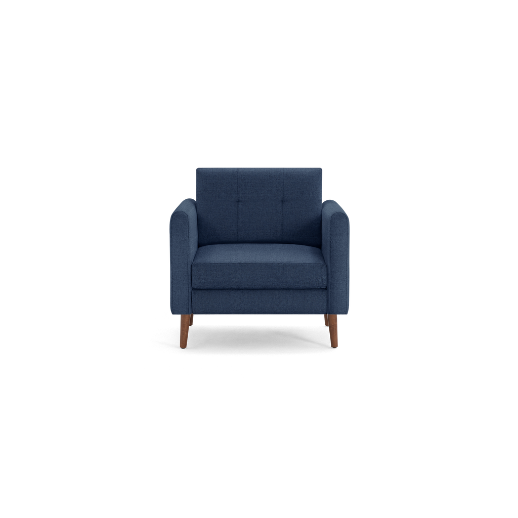 Dark blue upholstered armchair with wooden legs, cushioned seat, and tufted backrest in a modern design.