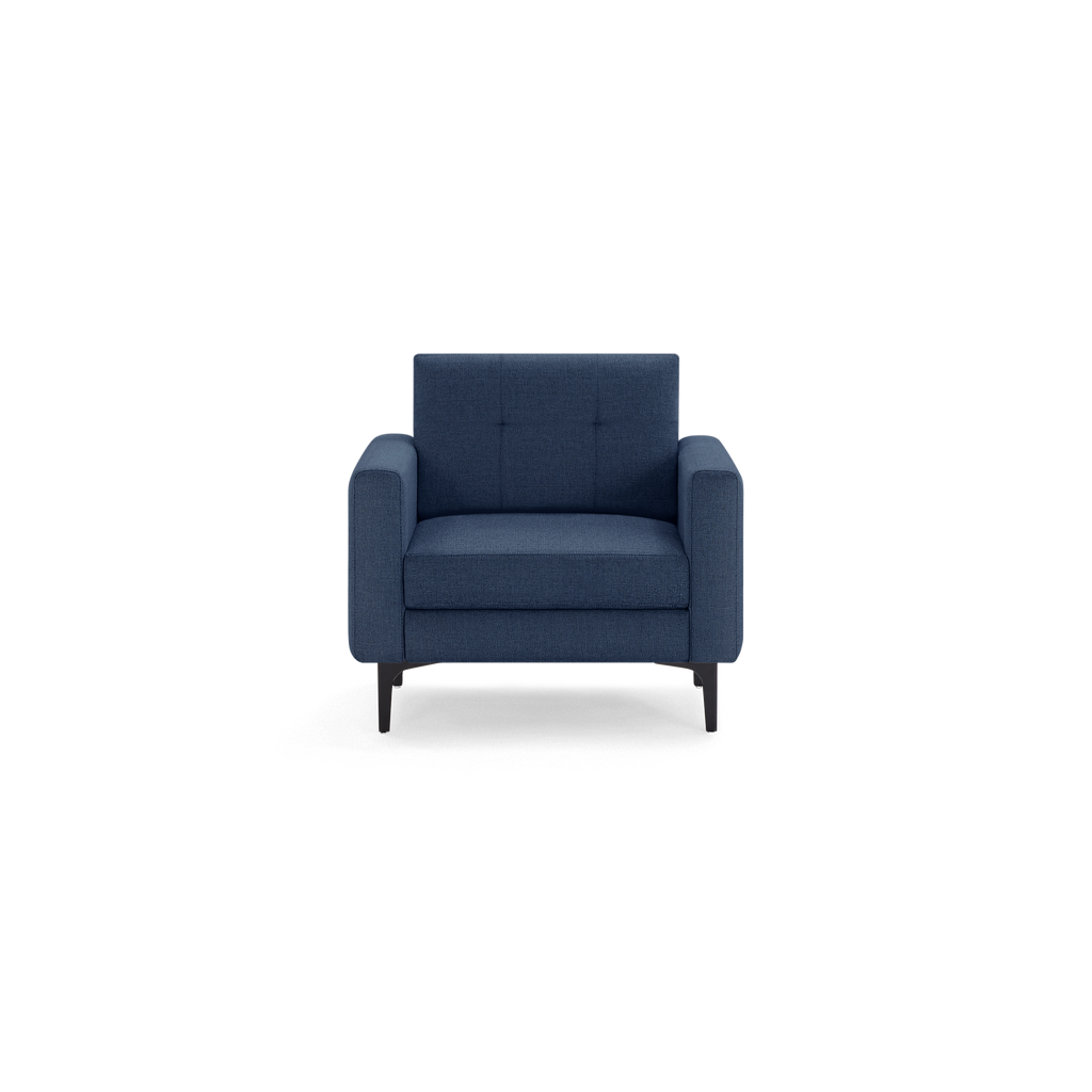 Dark blue upholstered armchair with cushioned seat and backrest, supported by black metal legs, modern and minimalist design.