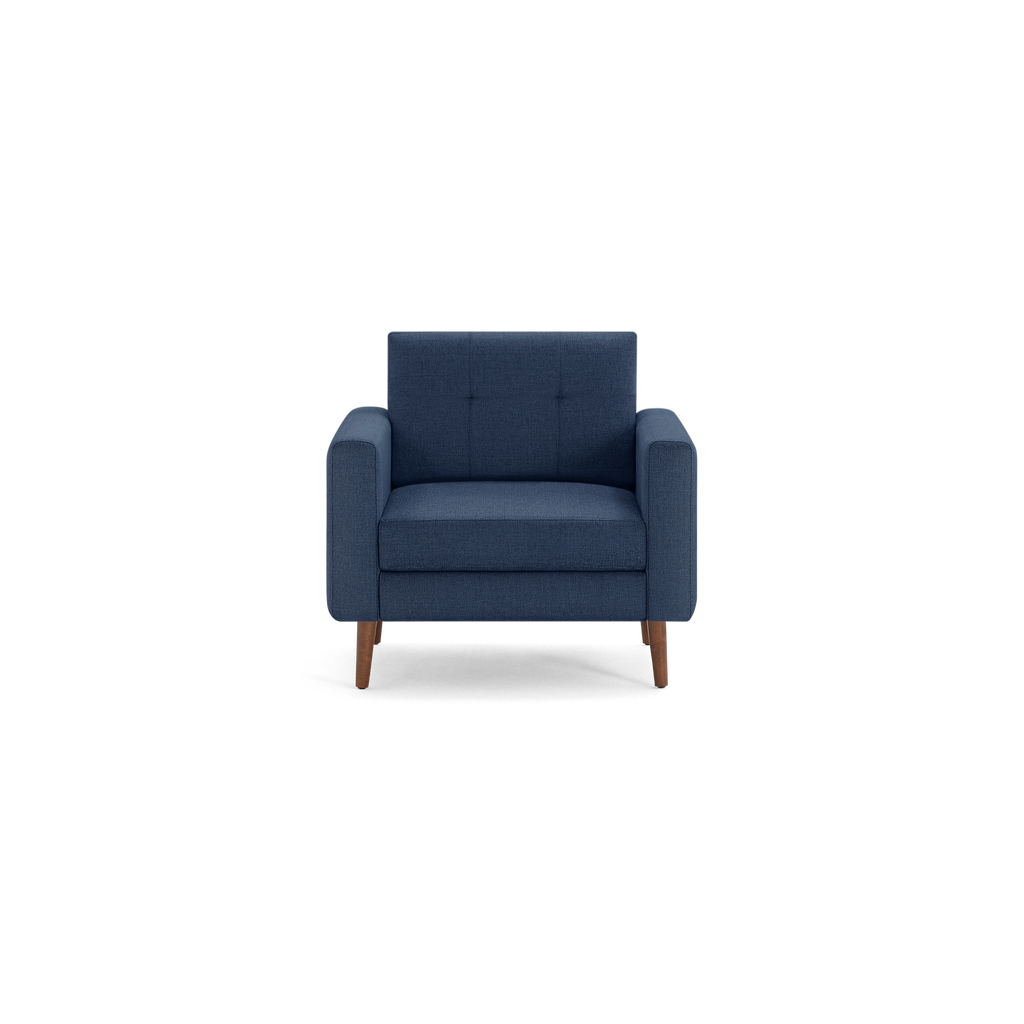 Modern navy blue upholstered armchair with wooden legs, featuring cushioned seat and backrest, and square armrests.