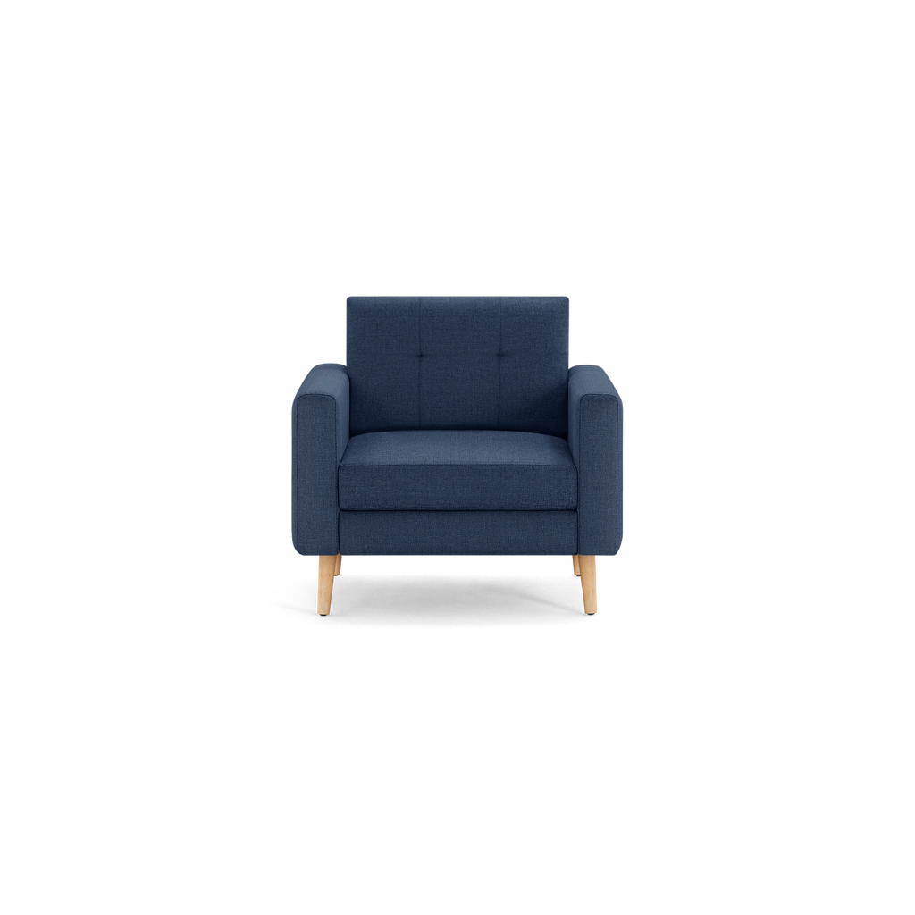 Modern navy blue upholstered armchair with square arms, tufted backrest, thick seat cushion, and light wooden legs.