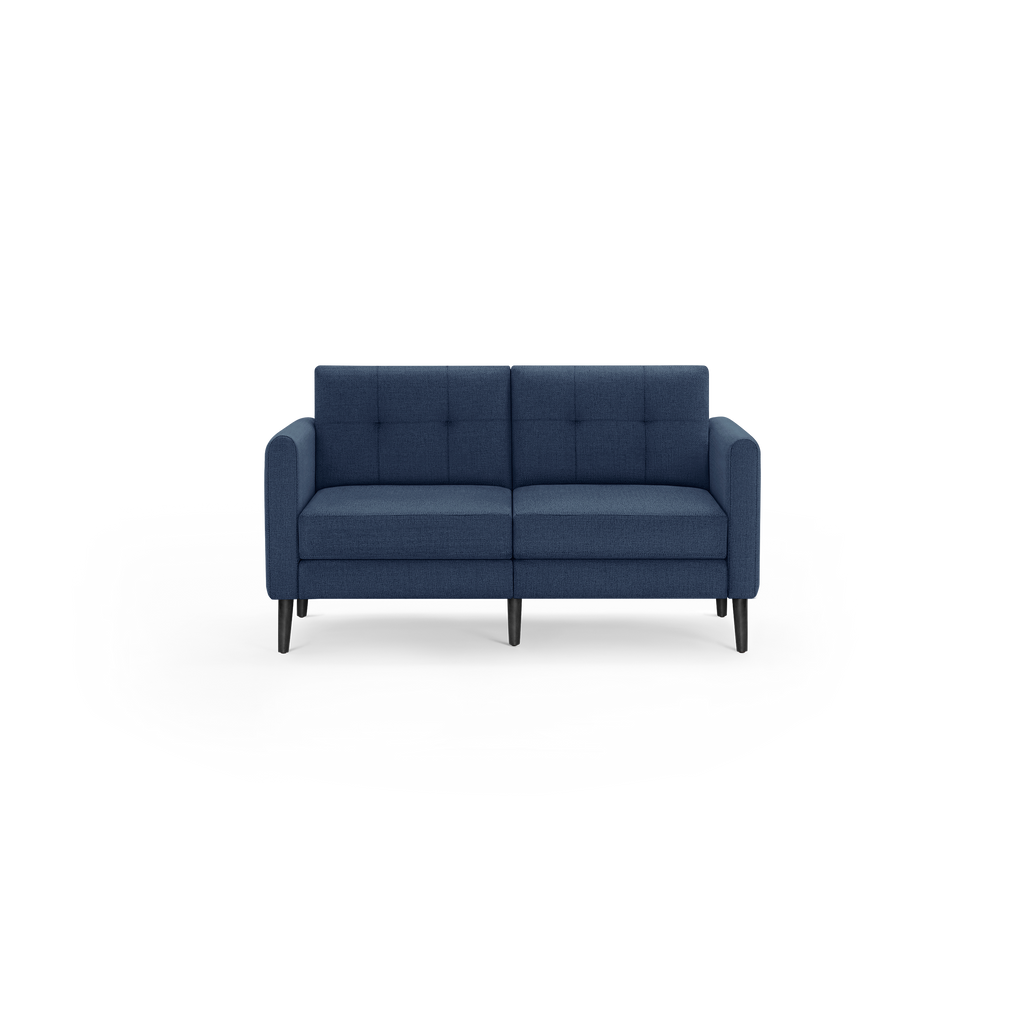 Modern two-seater sofa in navy blue fabric upholstery with tufted backrest, cushioned seats, and black tapered wooden legs.