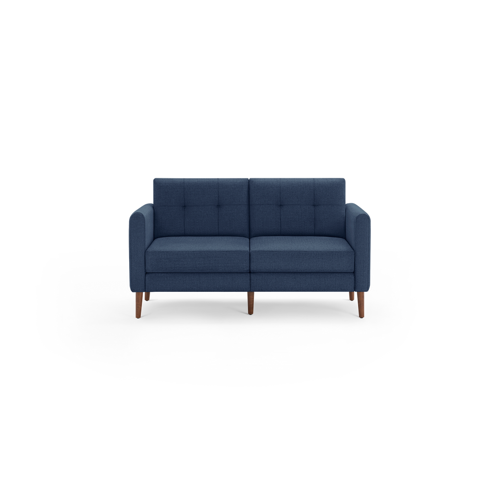 Modern two-seater sofa with navy blue tufted fabric upholstery and wooden legs, featuring straight armrests and cushioned seats.