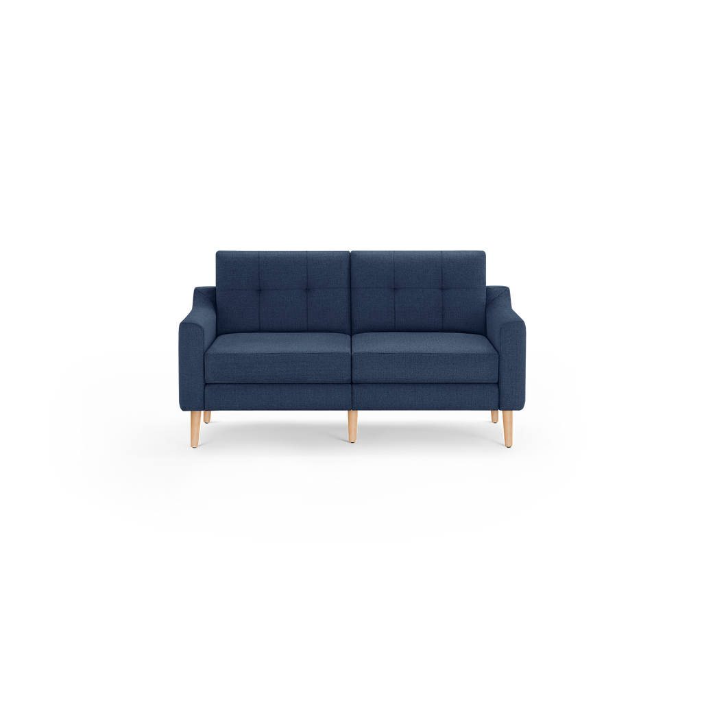Modern navy blue fabric sofa with tufted back cushions and wooden legs, featuring clean lines and plush seating for two.